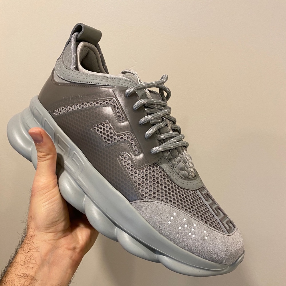 Brand new never worn Versace Chain Reaction with dust bags.